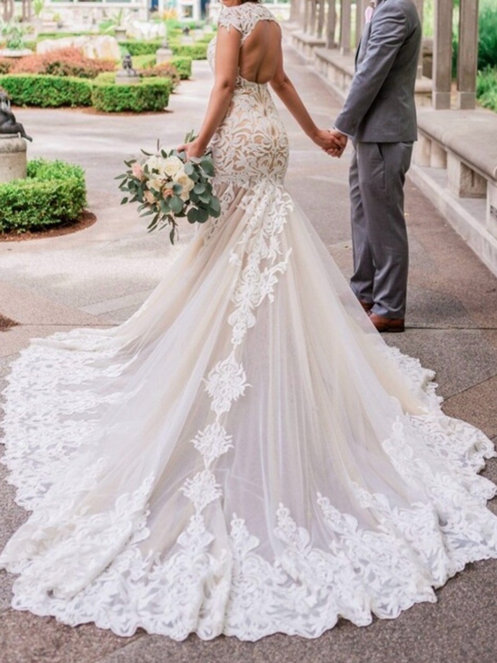 Elegant Lace-Embellished Ivory Wedding Dress with Long Train
